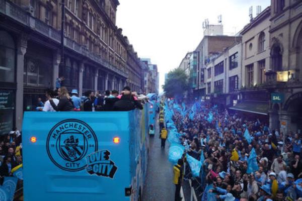 PARKING THE (PARTY) BUS): A general view during a trophy parade in Manchester, after they won their fourth successive Premier League title and their sixth in seven years. Pic: Bradley Collyer/PA Wire.